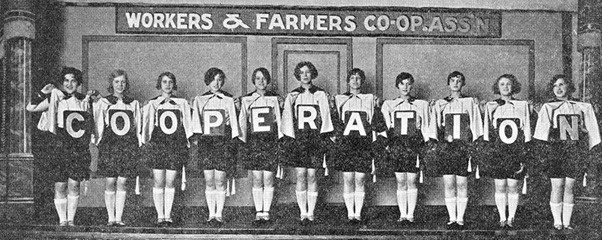 Women holding cooperation signs